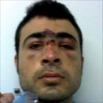 Refugees emailed a photo of a battered man after the riots.